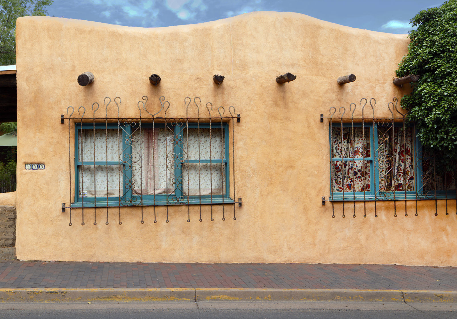 Street Side Adobe Home with Ornamental Ironwork